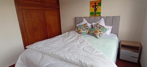 Säng eller sängar i ett rum på Elemental Hostel Coliving