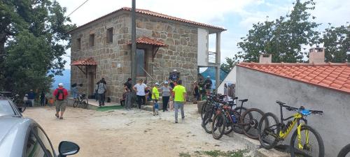a group of people standing outside of a building with bikes at Quinta do Cadaval in Cortiçô