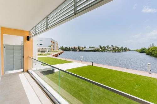 a balcony with a view of the water at ONE Canal Point in Upper Land
