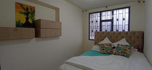 En eller flere senger på et rom på Elemental Hostel Coliving