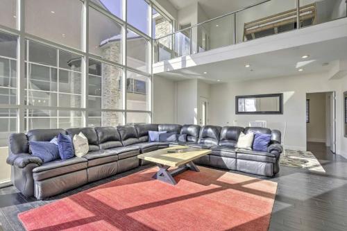 a living room with a leather couch and a coffee table at The Lofts #8d - Right by Ski Lifts in Brian Head