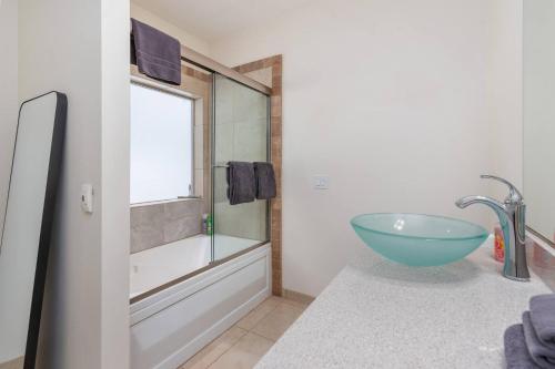 a bathroom with a glass bowl sink and a tub at The Lofts #9d - Ski-inout With Private Hot Tub in Brian Head