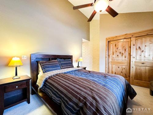 a bedroom with a bed and a ceiling fan at Silver Star Ski Retreat W Private Hot Tub! in Park City