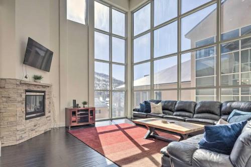 a living room with a couch and a table at The Lofts #8d - Right by Ski Lifts in Brian Head