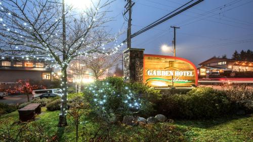 a building with a sign that reads christmas motel at Gibsons Garden Hotel in Gibsons