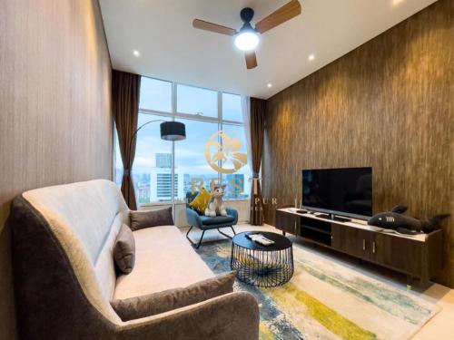a living room with a couch and a flat screen tv at Luxury property 2024 new in Gua Sai