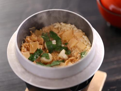 a bowl of food with meat and vegetables on a table at Hotel Asafuji in Fujikawaguchiko