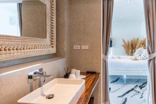 a bathroom with a sink and a mirror at Luxury 5 bedroom oceanview villa in Bophut with Staff in Amphoe Koh Samui