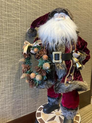 a santa claus figurine is standing on a table at Ryoso Chatani in Kyoto