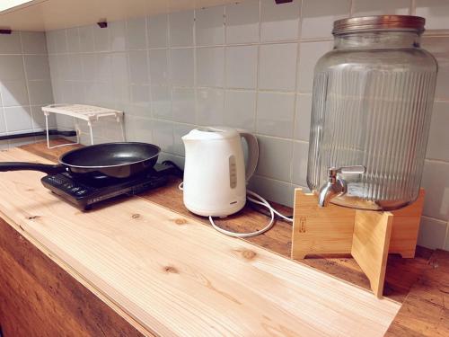 a counter with a toaster and a blender on it at ReA house 心斎橋.島之内 in Osaka