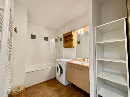 a small bathroom with a washer and dryer in it at Appartement Flumet, 2 pièces, 4 personnes - FR-1-505-202 in Flumet