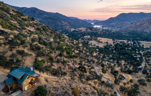 an aerial view of a house on a hill at 4 Kings Log Cabin 150 Acres Spectacular Views in Three Rivers