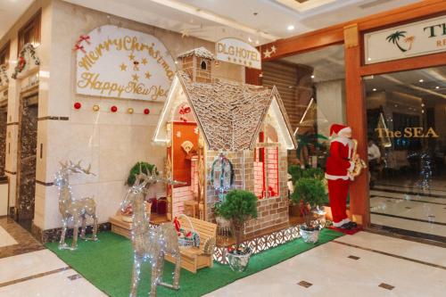 a christmas display of a gingerbread house in a store at DLG Hotel Danang in Da Nang