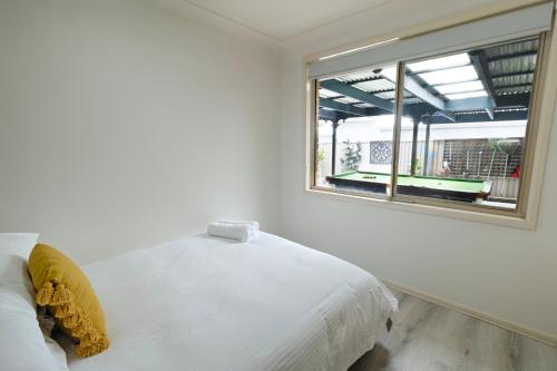 Ένα ή περισσότερα κρεβάτια σε δωμάτιο στο Central Coast Guest House