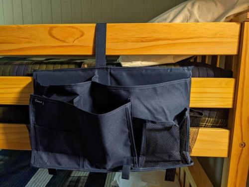 a black bag hanging on the side of a bunk bed at Evergreen Escape At Snowshoe in Snowshoe