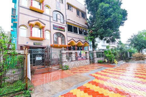 a building with a colorful sidewalk in front of it at FabHotel Sriya - City Center, Durgapur in Durgāpur