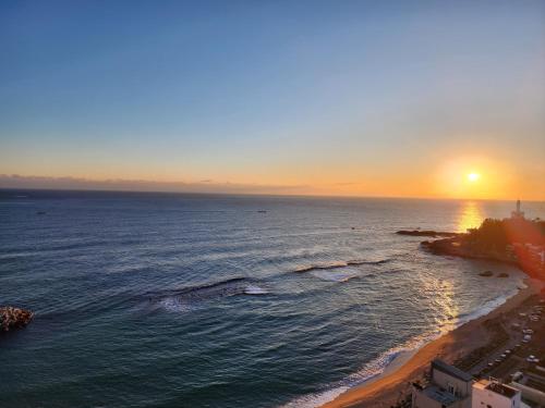 an aerial view of a beach at sunset at Sokcho Summitbay 1701 "Ocean View" in Sokcho