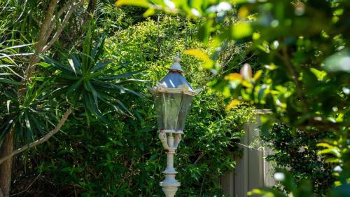 a street light in front of a fence at Marilyn's in Callala Beach
