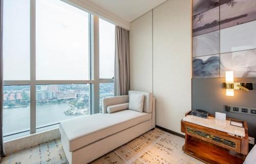 Ένα ή περισσότερα κρεβάτια σε δωμάτιο στο Wyndham Grand Suzhou Fenhu
