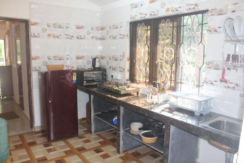 a kitchen with a counter top and a sink at RED HOUSE - AGONDA BEACH in Agonda