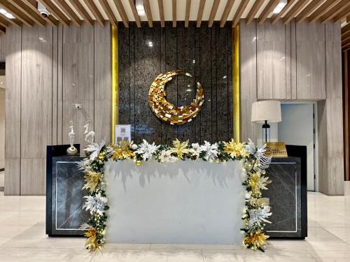 a table with flowers on it in a room at 1BR BGC Uptown Modern Condo Netflix 200Mb Wifi in Manila