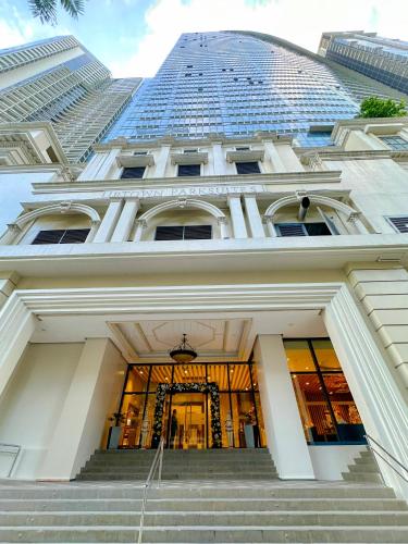 a building with stairs and a tall building at 1BR BGC Uptown Modern Condo Netflix 200Mb Wifi in Manila