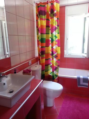 a bathroom with a toilet and a sink at Villa Anna Maria in Kriopigi