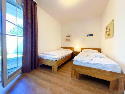 Katil atau katil-katil dalam bilik di Ferienwohnung Neptun FeWo 01 - Terrasse, Garten