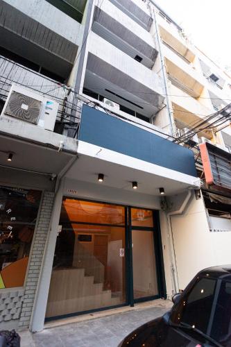 a building with a car parked in front of it at A1 Duplex large room wt kitchen in Bangkok