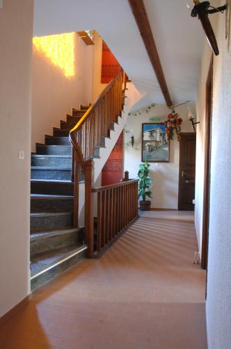 a staircase in a house with wooden stairs at Rigas Hotel Arachova in Arachova