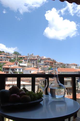a plate of fruit on a table on a balcony at Rigas Hotel Arachova in Arachova