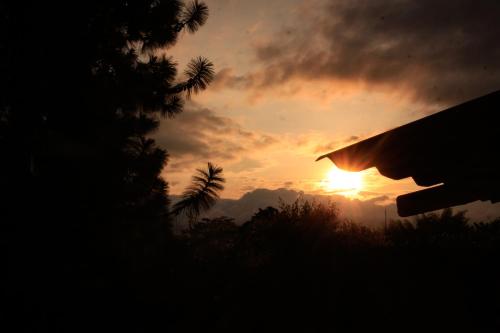 a silhouette of a person looking at the sunset at San Julio Campestre in Borrero Ayerbe