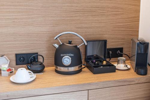 a black tea kettle sitting on top of a counter at Fincahotel Treurer - Olive Grove & Grand House - Adults Only in Algaida