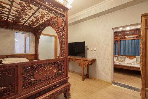 Μια τηλεόραση ή/και κέντρο ψυχαγωγίας στο Beijing Rong Courtyard Boutique Hotel