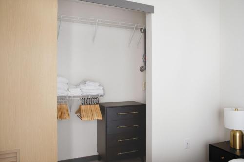 a room with a closet with a black dresser at Bellevue jr 1br w garden wine lockers nr bars SEA-616 in Redmond