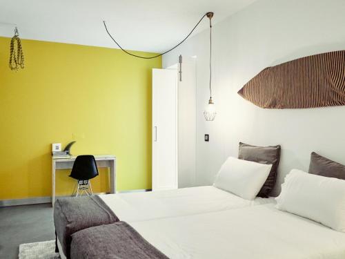 Postel nebo postele na pokoji v ubytování Bonvalot Guest House