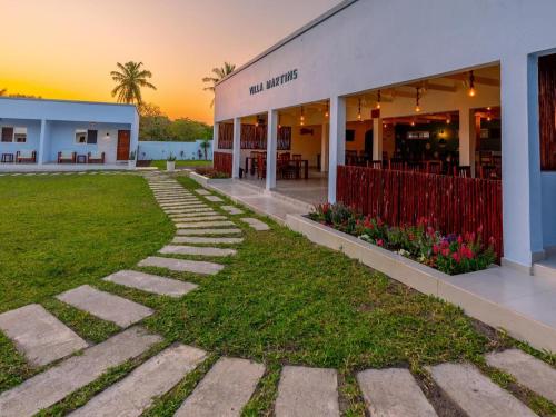 a building with a lawn in front of it at Villa Martins, Inhaca, Mozambique in Portinho da Inhaca