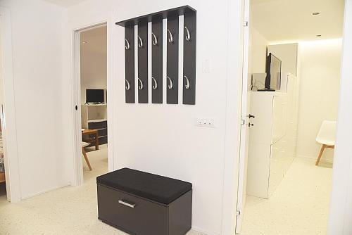 a room with a door with hockey sticks on the wall at Borgo Santa Lucia Apartment with Private Parking & Garden in Gubbio