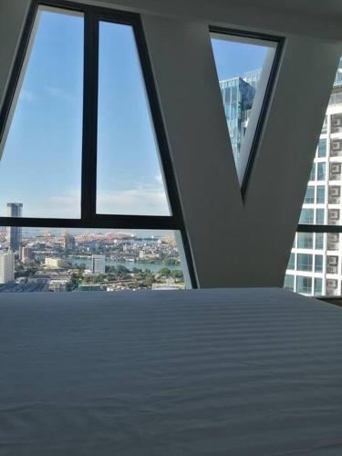 a room with a view of a building with windows at Luxe Colombo Heights in Colombo