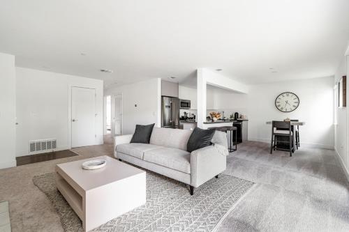 a living room with a white couch and a table at Sharon Green apartments by FantasticStay in Menlo Park