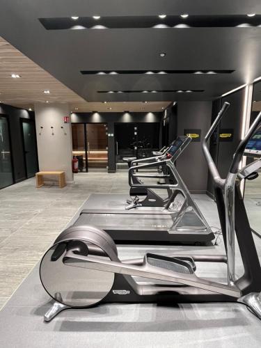 a row of treadmills in a gym with a row at Standing Megeve - 2 to 8 people - Mont d'Arbois in Megève