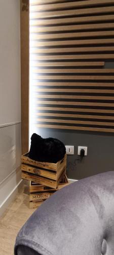a bedroom with a bed and a stack of boxes at Résidence Bel'Air in Aire-sur-la-Lys