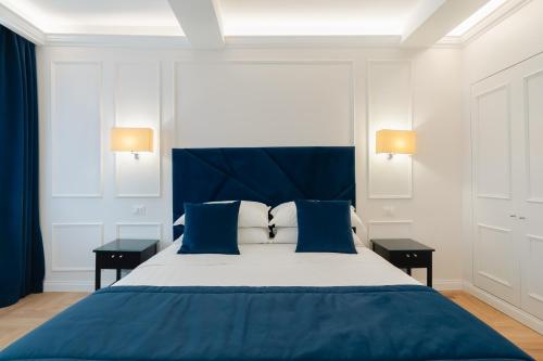 Postelja oz. postelje v sobi nastanitve Relais del Portico