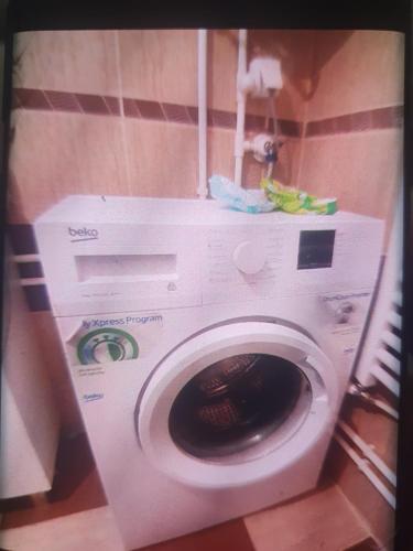 a washing machine in a room with at BIANCA LuX in Kraljevo