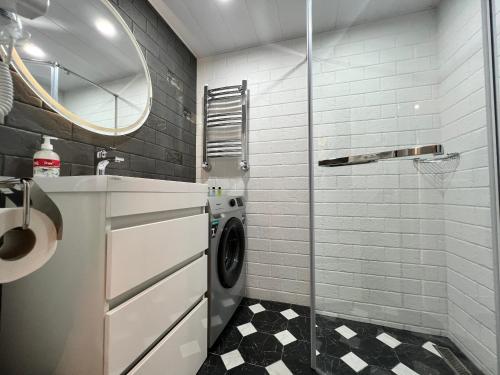 a laundry room with a washer and dryer at Tiny modern home in 1st floor, Saryan in Yerevan