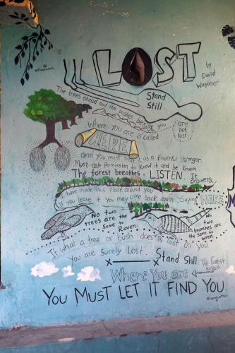 a drawing of a writing on a wall at Clan Boho in Rishīkesh