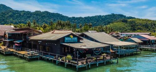 a group of buildings on a body of water at Tonmai Suite II in Ko Por