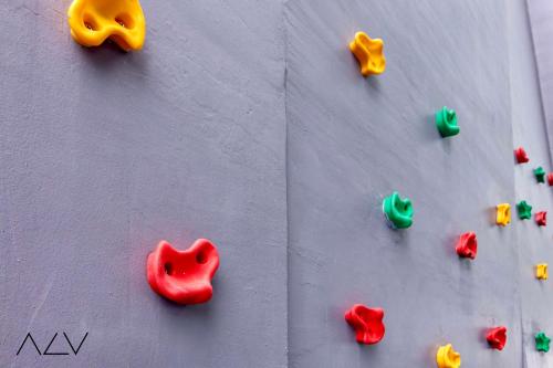 a wall with different colored rocks on it at Urban Suites, Spectre Collection by Stellar ALV in Jelutong