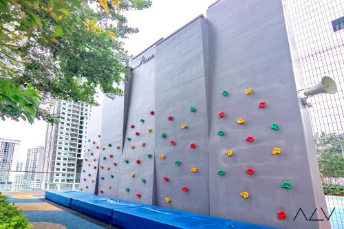 a wall with a climbing wall in a city at Urban Suites, Spectre Collection by Stellar ALV in Jelutong