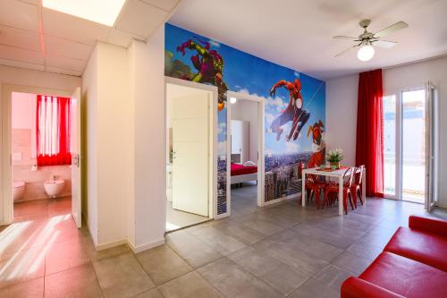 a living room with a table and a dining room at Rabbit Home in Misano Adriatico